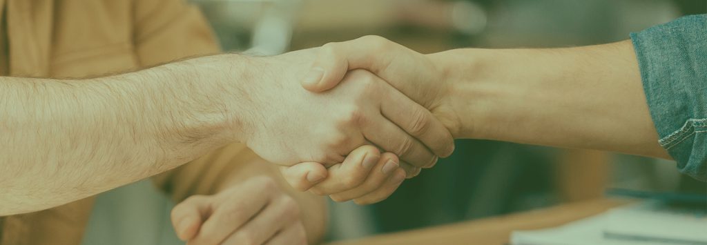 Handshake between design agency and cannabis entrepreneur