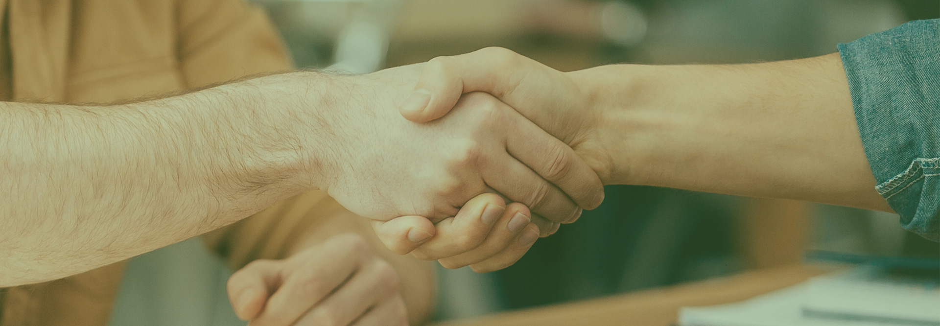 Handshake between design agency and cannabis entrepreneur