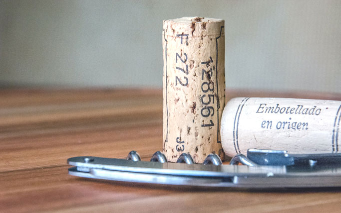 cork and corkscrew on table